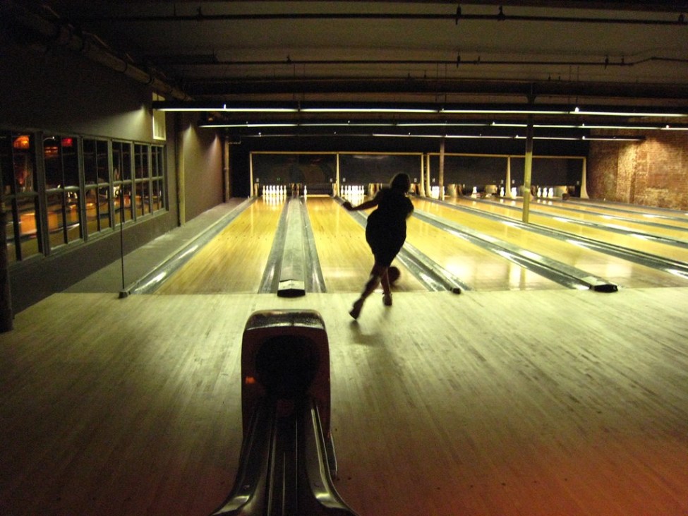 Woman Bowling at The Gutter